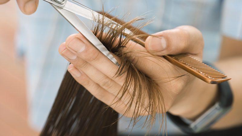 hairdresser-cutting-woman-s-hair-in-salon-focus-on-hair-hands-and-scissors-close-up-78119917-57f6a5a55f9b586c3535c1b6-e1589389549215
